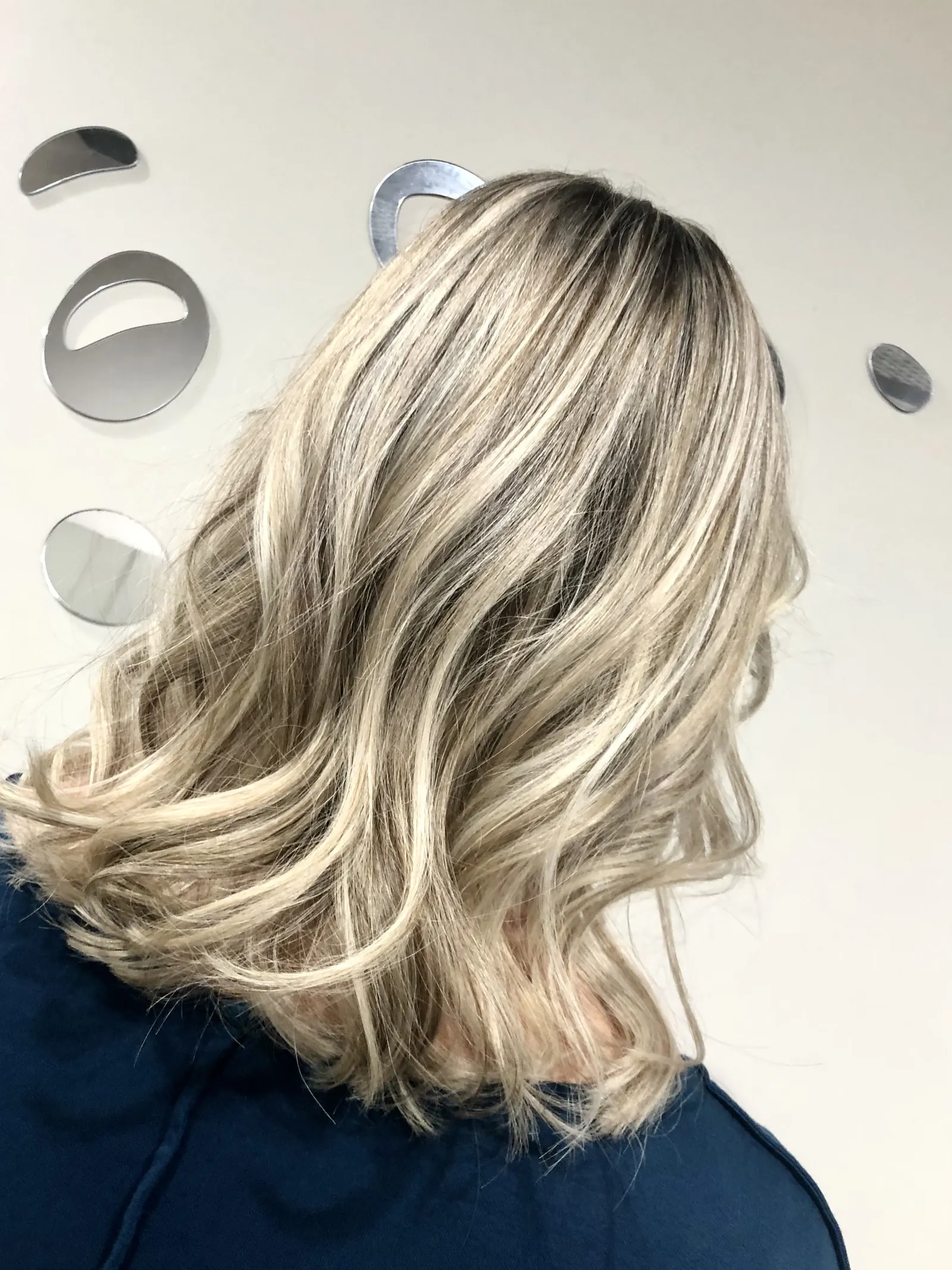 Ash blonde balayage, medium wavy