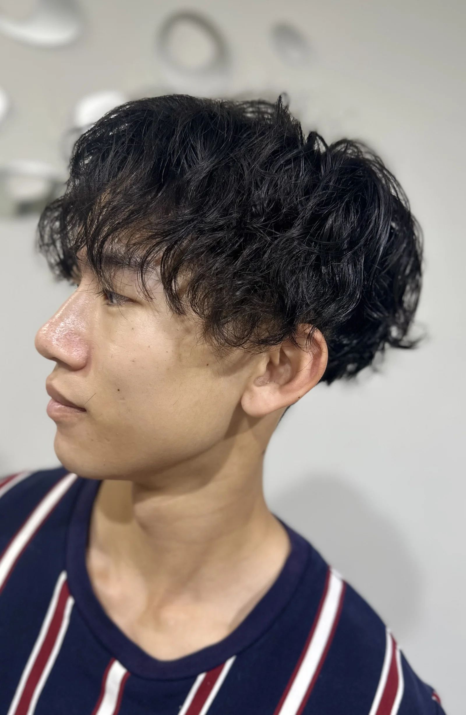 Men's dark curly textured perm