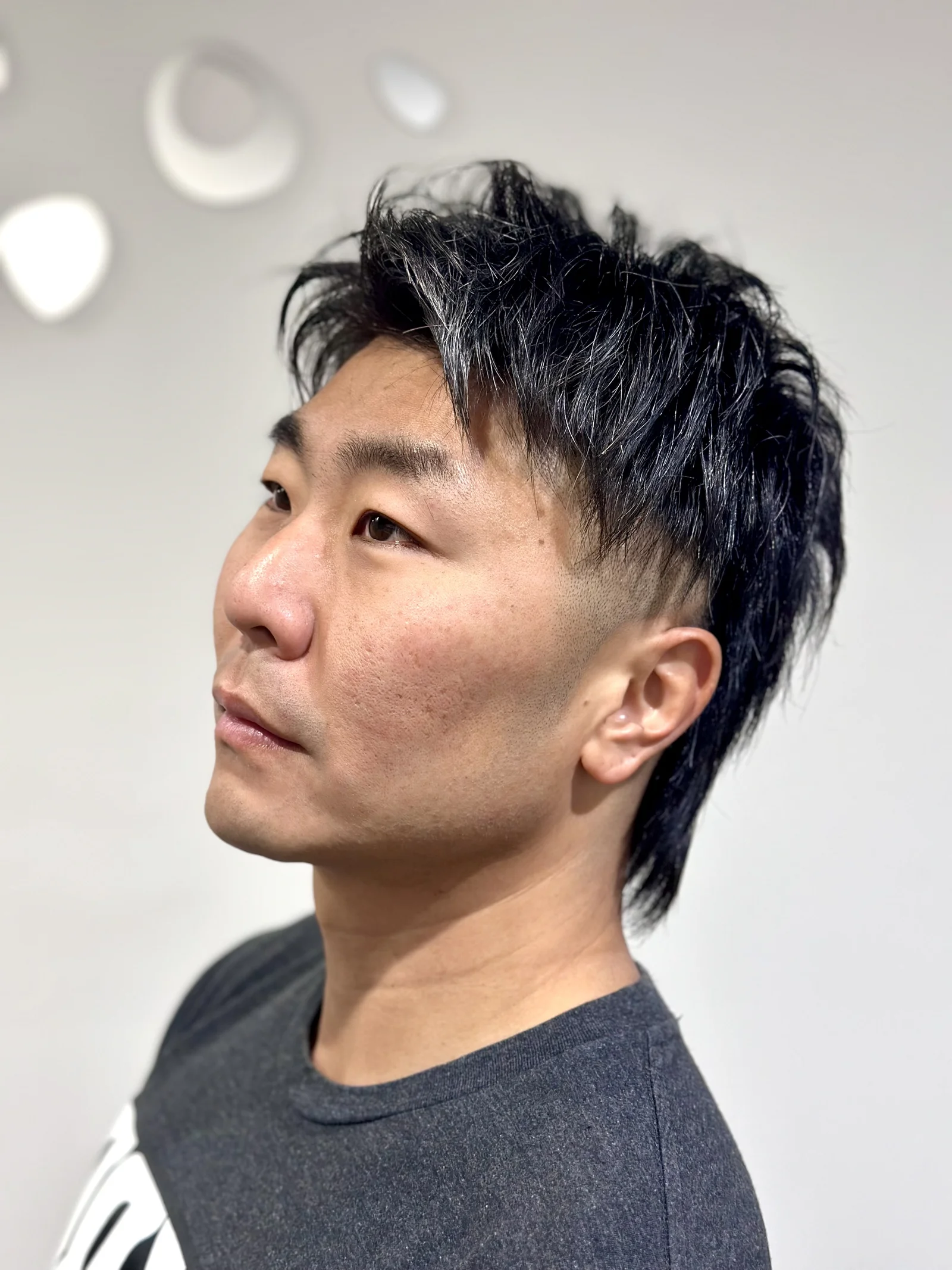 Men's dark wolf cut mullet with fade