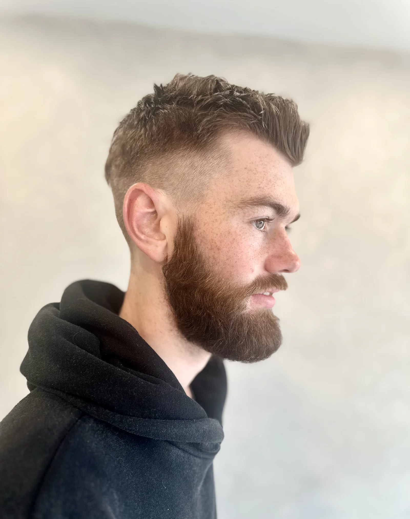 Men's fade undercut with full beard