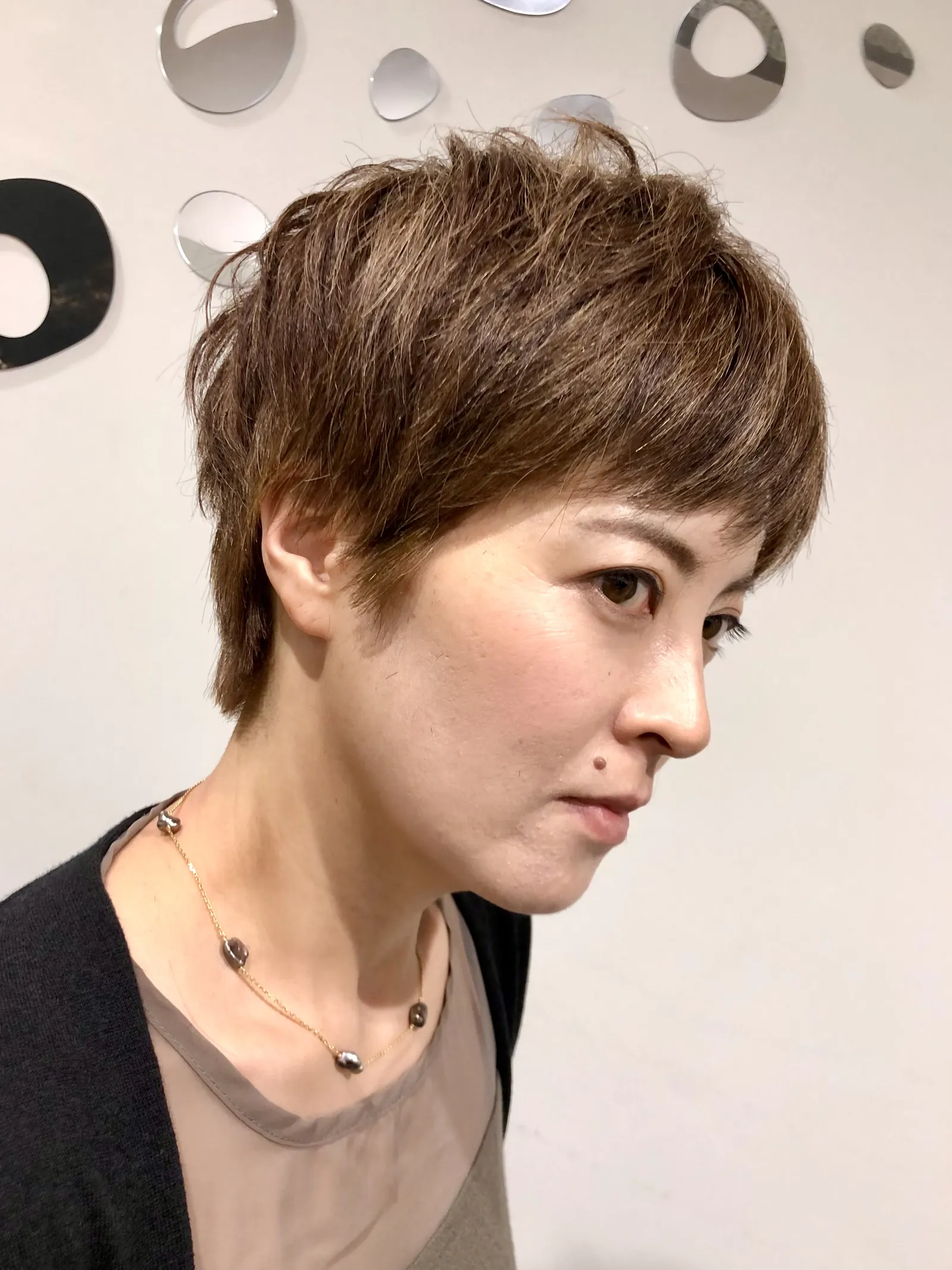 Short textured brown pixie cut