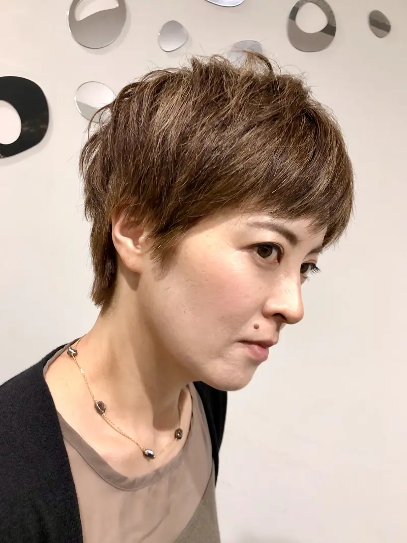 Short textured brown pixie cut